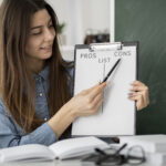 medium shot smiley woman holding clipboard